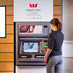 Image of a customer withdrawing cash