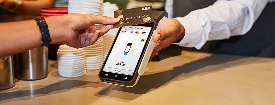 Image of a mobile business taking a tap and go card payment.