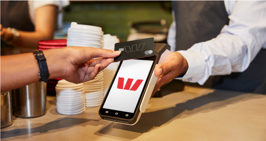 Image of an EFTPOS machine taking a card payment.