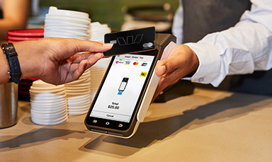 Image of an EFTPOS machine taking a card payment.
