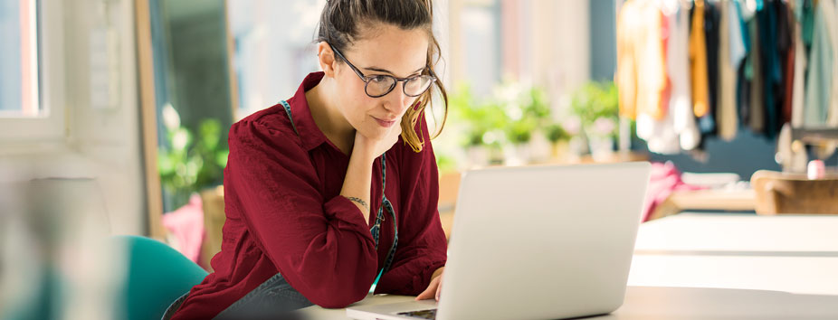 Image of an eCommerce business owner about to take a payment online.