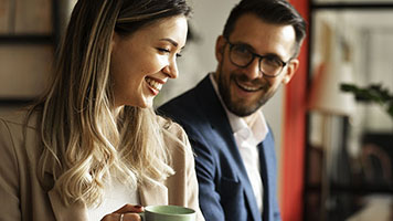 Businessman and businesswoman working together in the office. Colleagues working on the project.