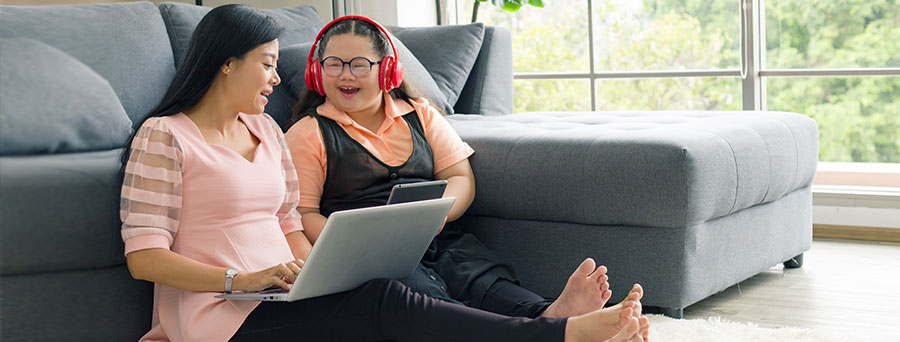 Customers reading information on a laptop